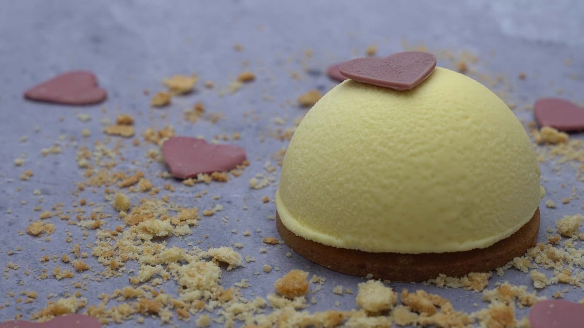 A lemon dessert with a chocolate heart, ringed with sponge crumb