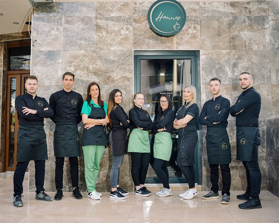 The Hannes team outside the entrance, in black and green uniforms